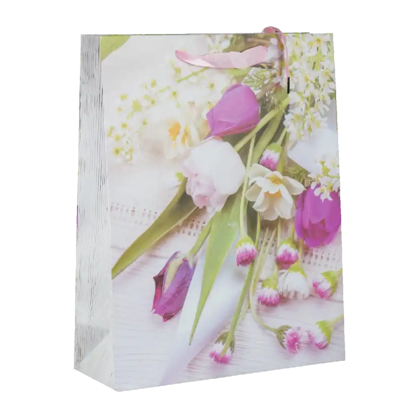 Torebka prezentowa w kwiaty 40x31x12 cm wykonana z papieru. Posiada wiosenny motyw roślinny, sznurkowe uchwyty oraz wzmocniony spód, co ułatwia pakowanie upominków dla niej na wiele okazji.