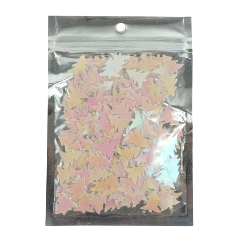Zapas confetti w kształcie choinek o rozmiarze 2 cm zamknięty w przezroczystym, foliowym opakowaniu o wadze 36 g.