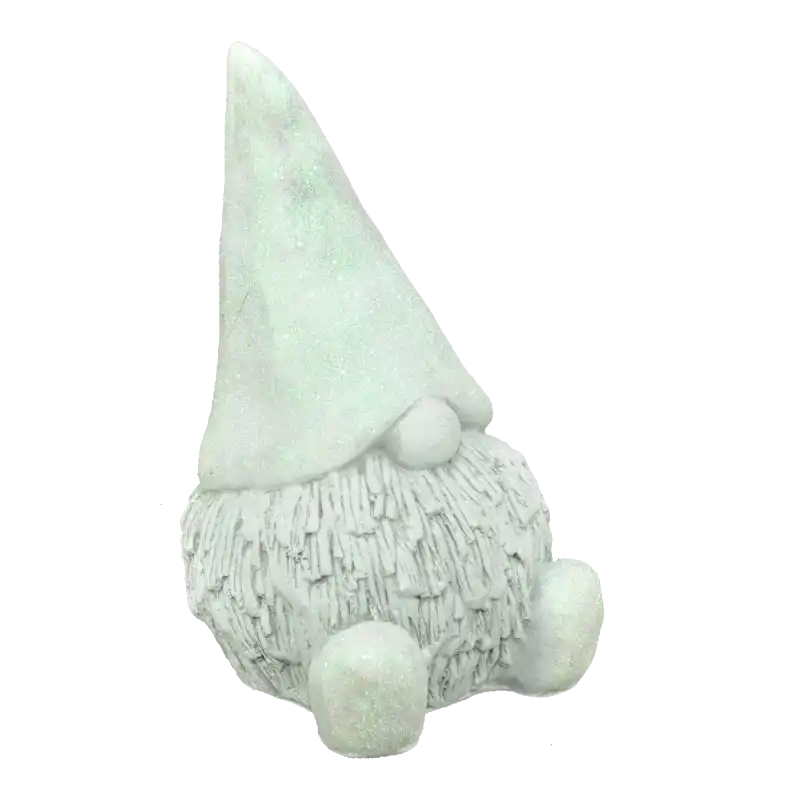 Gipsowy skrzat o wysokości 16 cm w kolorze szarym, ozdobiony brokatem. Figurka dekoracyjna z wyraźnym detalem czapeczki i brody, idealna do świątecznych aranżacji wnętrz.