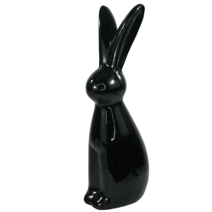 Czarny zając ceramiczny ustawiony w lekkim skosie, podkreślający jego minimalistyczny charakter w aranżacji.