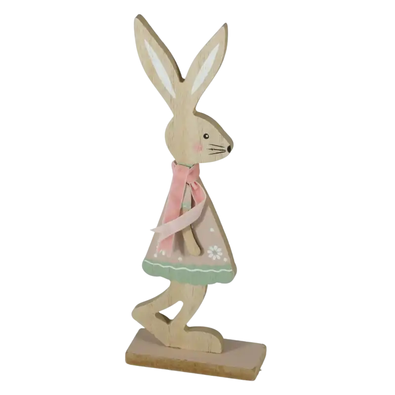 Drewniana figurka zajączka w formie dziewczynki z różowymi akcentami. Dekoracja o wysokości 24 cm idealna do wiosennych aranżacji wnętrz.