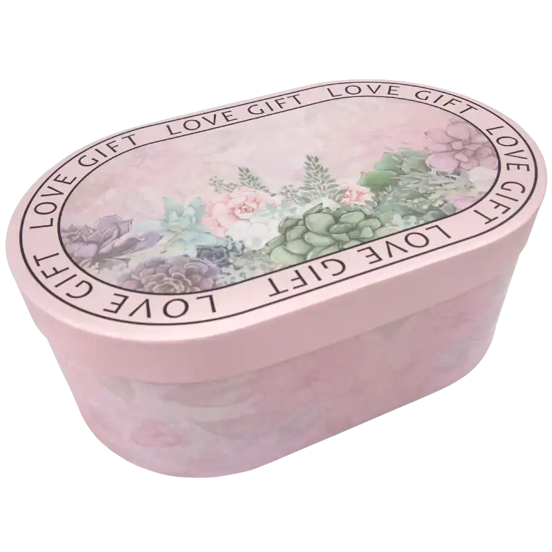 Owalny flower box z kwiatowym nadrukiem i napisem Love Gift. Pudełko o wymiarach 32x20x12 cm, idealne na podziękowanie dla rodziców lub jako elegancka dekoracja domu.