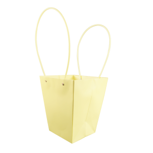 Żółta torebka na kwiaty o wysokości 42 cm wykonana z papieru. Posiada dwa wygodne uchwyty, które ułatwiają przenoszenie roślin. Produkt stanowi estetyczną oprawę prezentową dla kwiatów żywych oraz sztucznych.