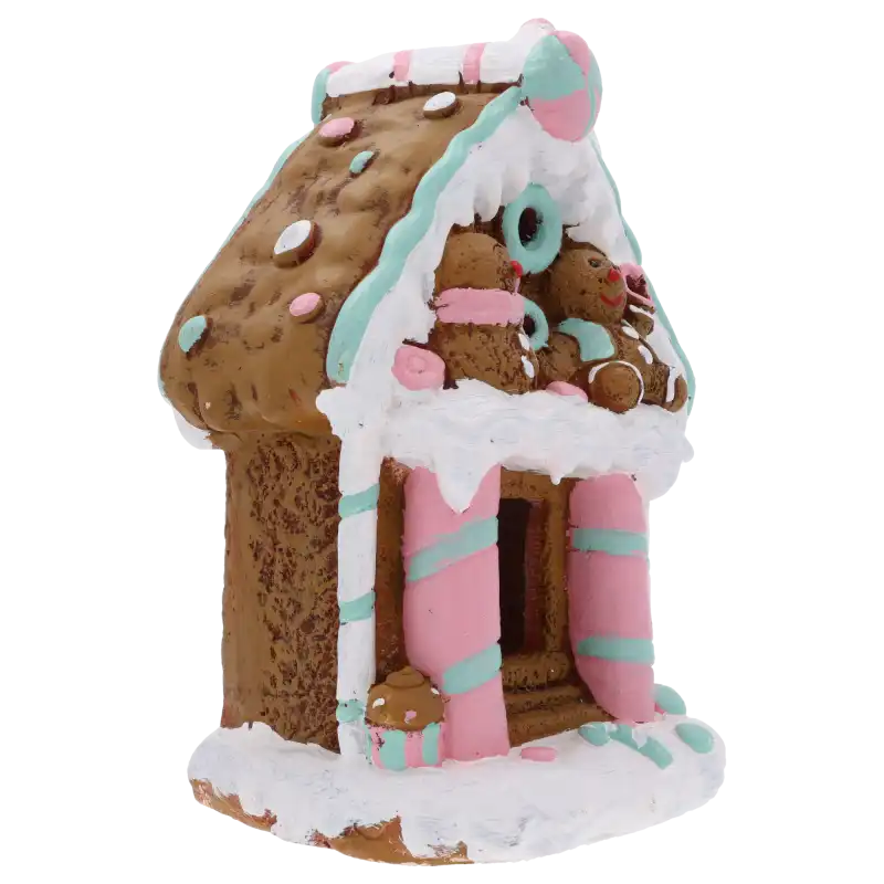 Świąteczny domek z piernika z ceramicznymi detalami w pastelowych kolorach, prezentowany w ujęciu półprofilowym.