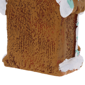 Boczna ściana ceramicznej ozdoby świątecznej, uwydatniająca teksturę przypominającą tradycyjny piernik.