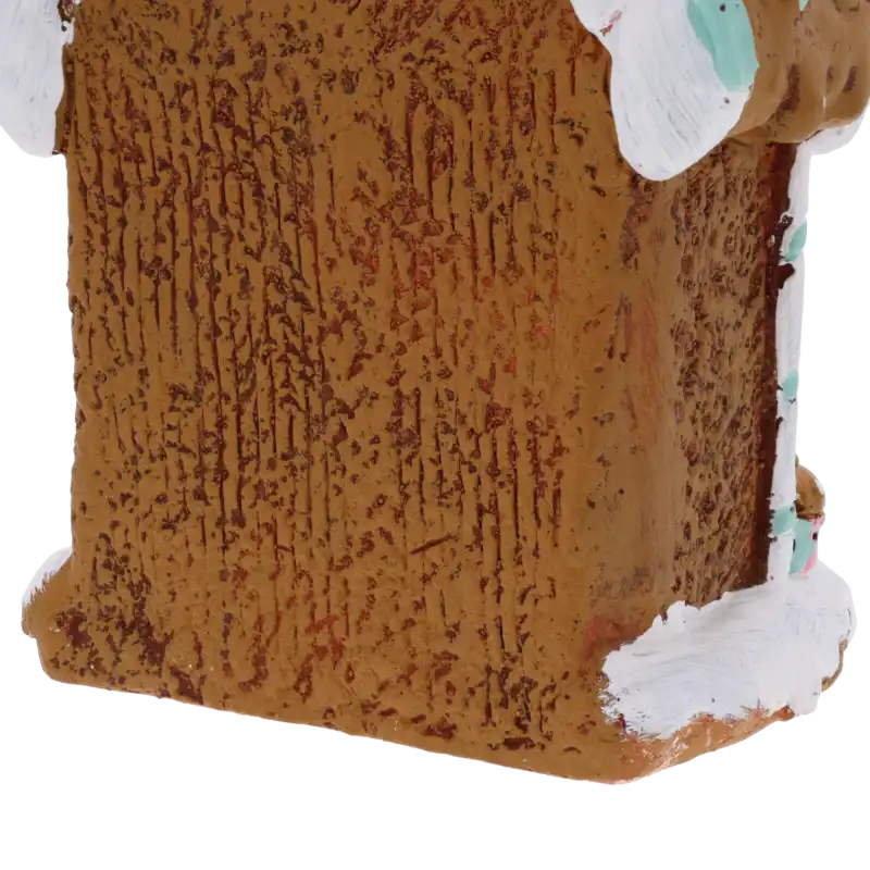 Boczna ściana ceramicznej ozdoby świątecznej, uwydatniająca teksturę przypominającą tradycyjny piernik.