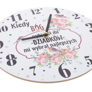 Zbliżenie na tarczę zegara 30 cm z napisem i grafiką ptaków oraz kwiatów w różowej kolorystyce.