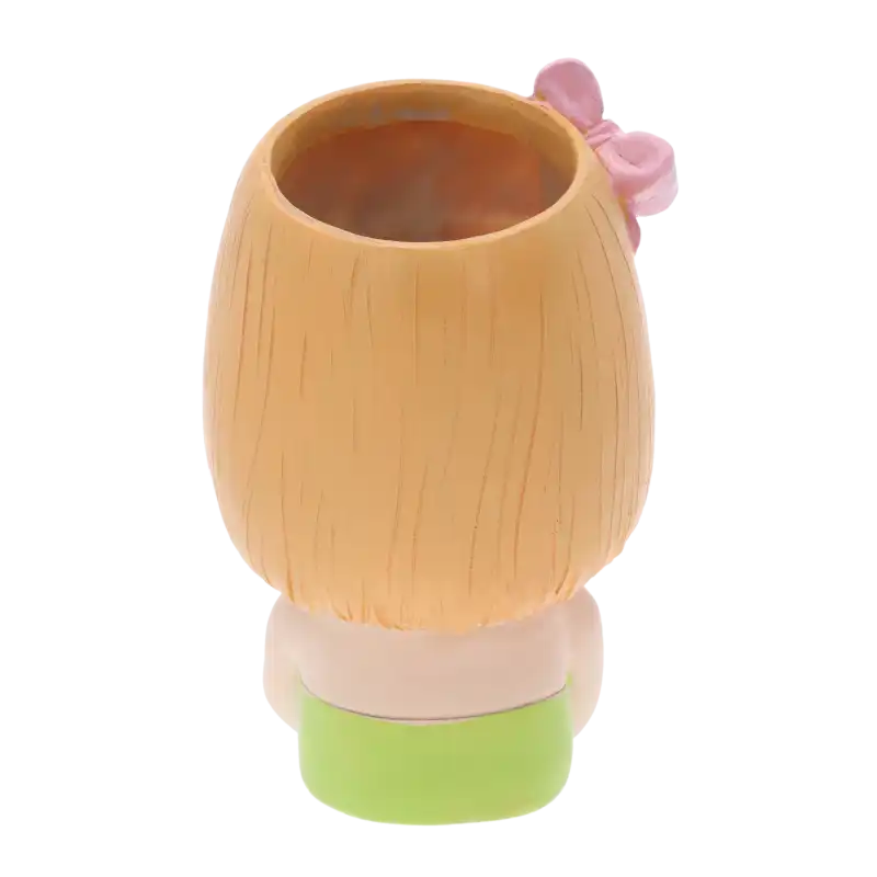 Tył ceramicznej osłonki w formie dziewczynki, ukazujący gładką fakturę oraz umiejscowienie kokardy.