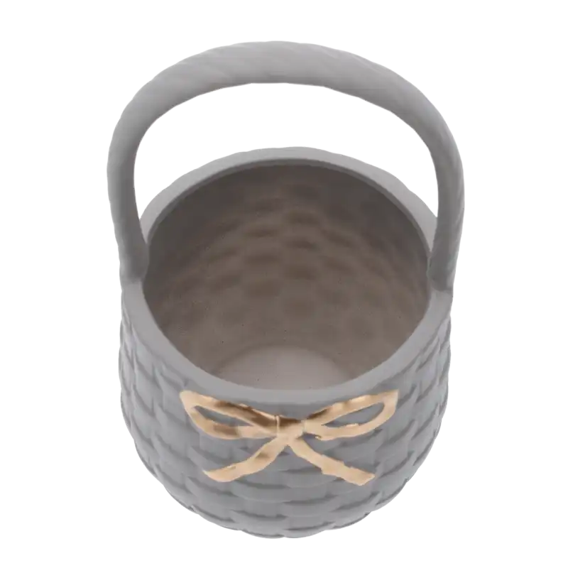 Wnętrze okrągłego szarego kosza gipsowego o średnicy 25 cm. Puste naczynie gotowe do wypełnienia kwiatami lub upominkami.