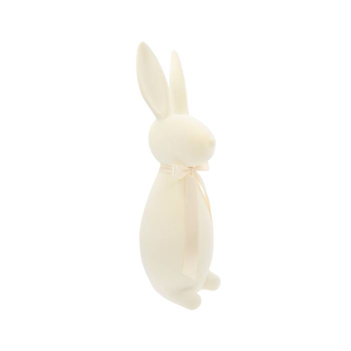 Kremowy zając wielkanocny flokowany o wysokości 47 cm. Ujęcie prezentujące sylwetkę z boku i profil głowy.