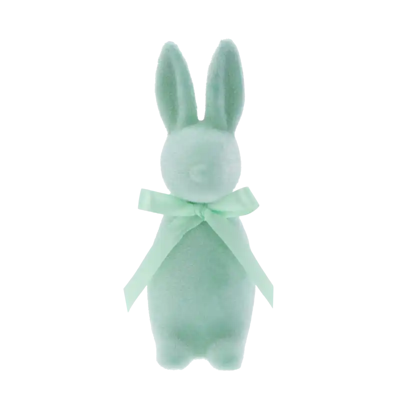 Turkusowy flokowany zając o wysokości 15 cm. Figurka posiada nowoczesną formę oraz elegancką kokardę na szyi, stanowiąc modną ozdobę wielkanocną do domu.