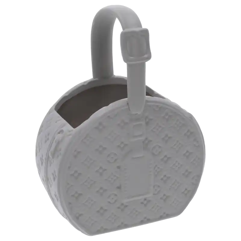 Szara gipsowa torebka kwiatowa S, nowoczesna ceramiczna osłonka z charakterystycznymi wytłoczeniami. Prezentuje się jako elegancka dekoracja do wnętrz w stylu minimalistycznym.