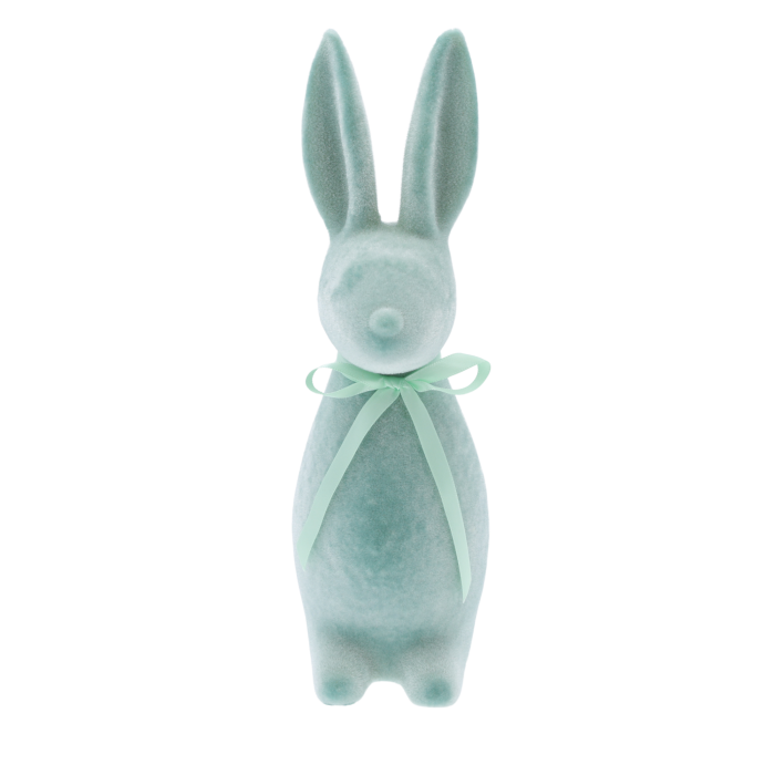 Turkusowy flokowany zając o wysokości 30 cm, ozdobiony satynową kokardą. Nowoczesna figurka wielkanocna prezentowana na wprost.