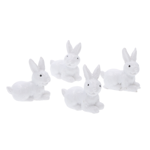 Zestaw 4 białych zajączków wielkanocnych o wysokości 3,5 cm. Miniaturowe figurki idealne do wiosennych stroików.