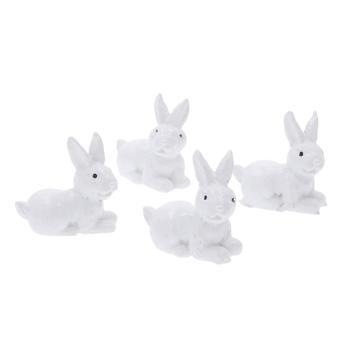 Zestaw 4 białych zajączków wielkanocnych o wysokości 3,5 cm. Miniaturowe figurki idealne do wiosennych stroików.