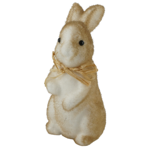 Brązowy flokowany zajączek wielkanocny o wysokości 15 cm. Figurka z drobinkami brokatu i słomkową kokardą, ujęta z profilu, idealna do świątecznych aranżacji.