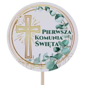 Zbliżenie na papierowy topper komunijny z krzyżem, średnica 7 cm, długość 29 cm, z motywem roślinnym i napisem Pierwsza Komunia Święta.