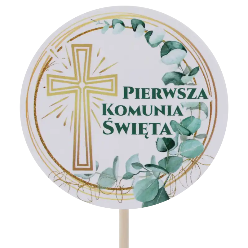 Zbliżenie na papierowy topper komunijny z krzyżem, średnica 7 cm, długość 29 cm, z motywem roślinnym i napisem Pierwsza Komunia Święta.
