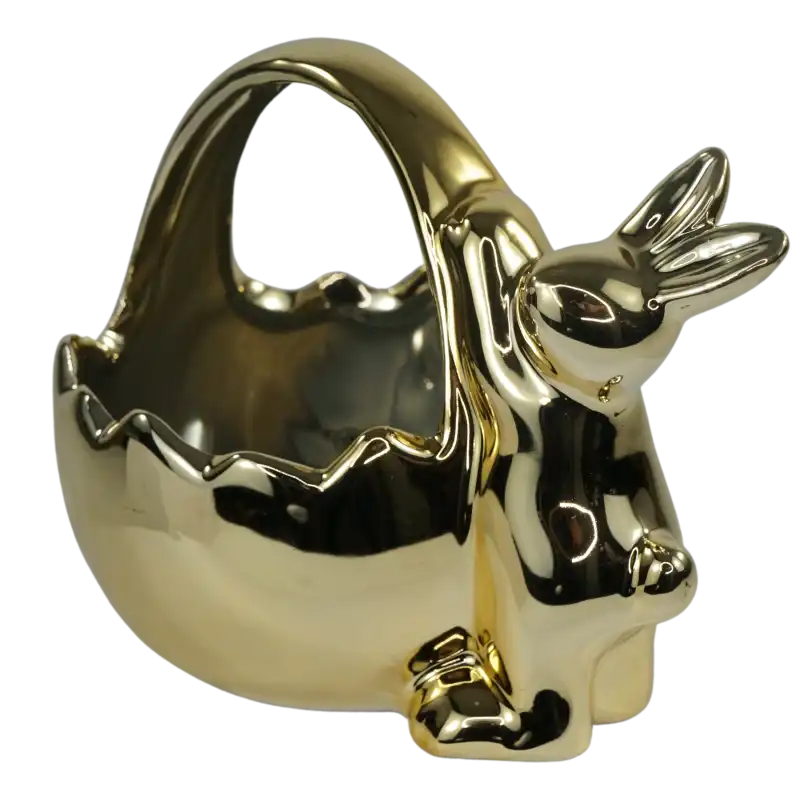 Nowoczesna ceramiczna osłonka w kolorze złotym, przedstawiająca zająca połączonego z koszyczkiem na wielkanocne kompozycje.