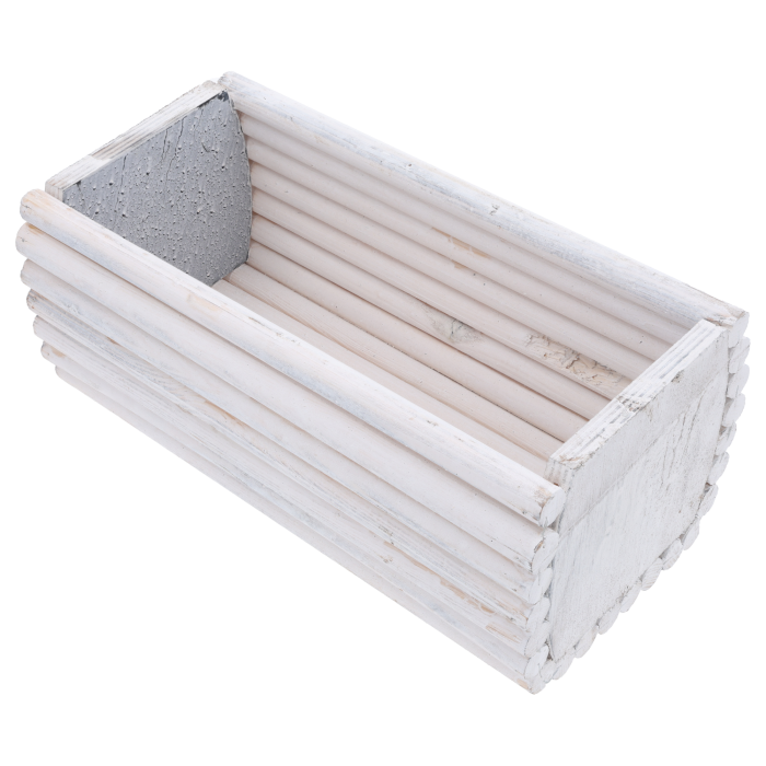 Wnętrze prostokątnej osłonki 30x15 cm wykonanej z białych drewnianych palików. Widoczna struktura naturalnego drewna.