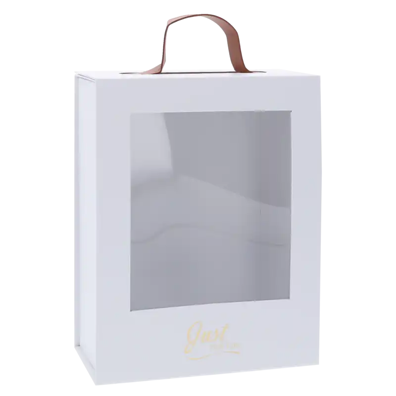 Pusty, biały flower box z przezroczystym okienkiem i brązowym uchwytem. Widoczny złoty napis Just For You w dolnej części opakowania.