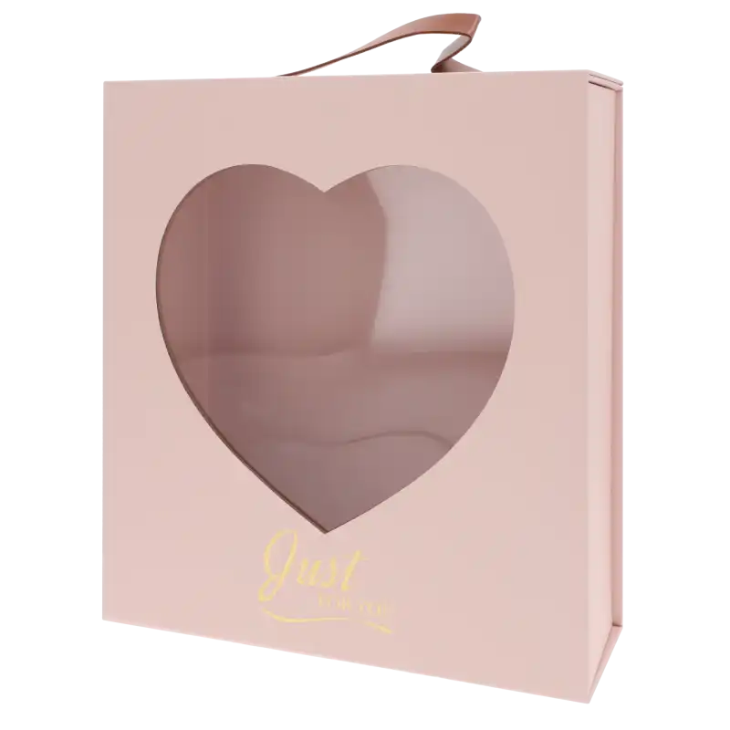Pusty, różowy flower box z przezroczystym okienkiem w kształcie serca oraz eleganckim złotym napisem Just For You na froncie.