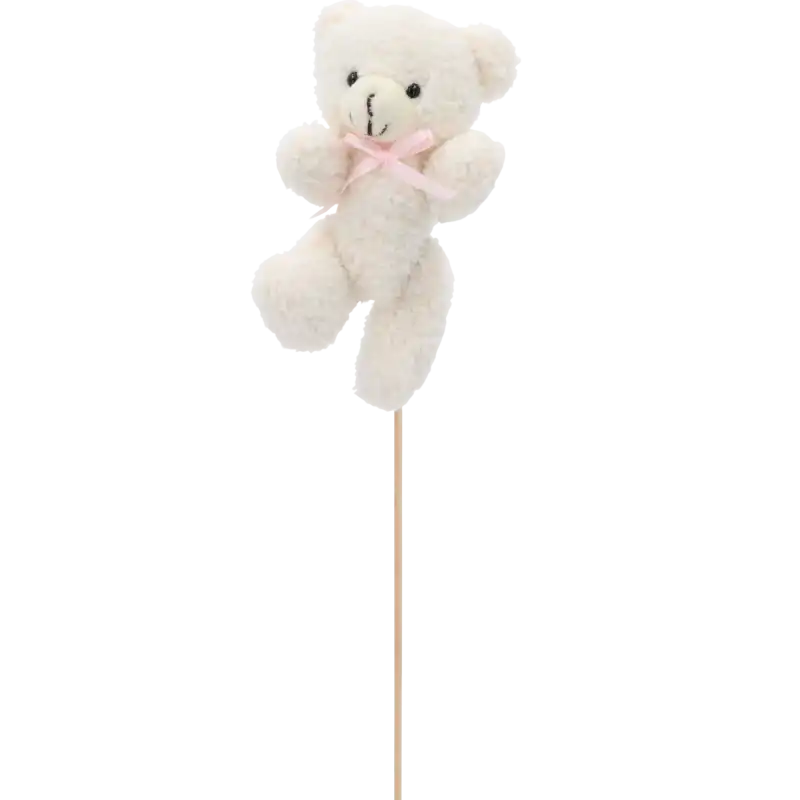 Pluszowy miś w pozycji lekko pochylonej, zamocowany na stabilnym piku florystycznym.