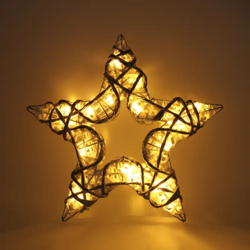 Świecąca gwiazda 35 cm emitująca ciepłe białe światło z 20 diod LED, idealna do stworzenia nastrojowej aranżacji.