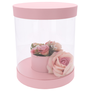 Różowy flower box 22 cm z przezroczystymi ściankami, prezentujący gotową kompozycję kwiatową wewnątrz pudełka.