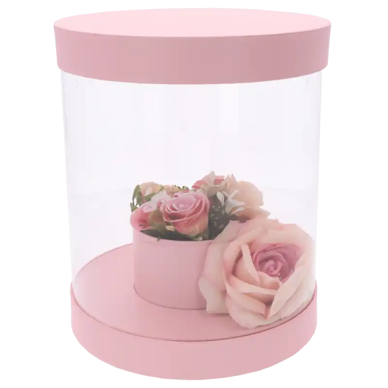 Różowy flower box 22 cm z przezroczystymi ściankami, prezentujący gotową kompozycję kwiatową wewnątrz pudełka.