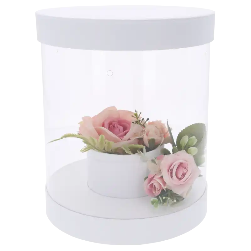 Biały flower box 22 cm z przezroczystymi ściankami i przykładową kompozycją kwiatową wewnątrz. Składane pudełko o wysokości 26 cm do samodzielnego przygotowania bukietów na różne okazje.