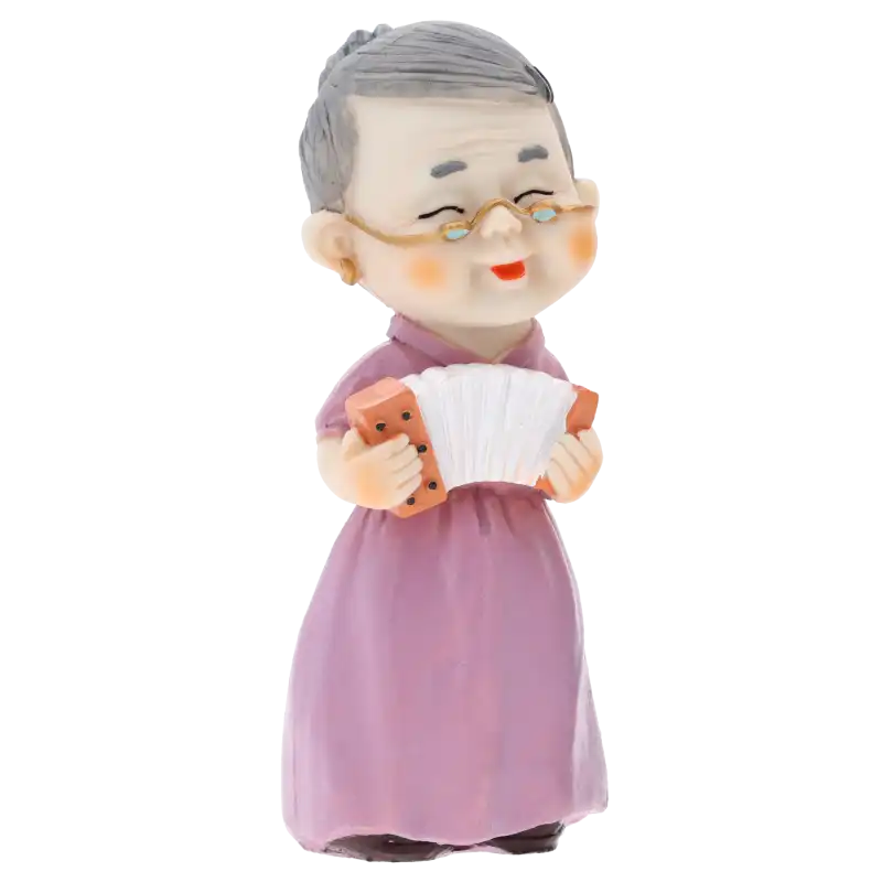 Figurka babcia z harmonią o wysokości 15 cm, wykonana z tworzywa. Przedstawia starszą panią w fioletowej sukni grającą na instrumencie.