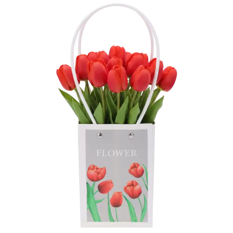 Torebka kwiatowa wypełniona bukietem czerwonych tulipanów, prezentująca praktyczne zastosowanie produktu w kompozycji florystycznej.