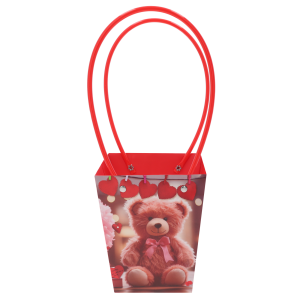 Papierowa torebka kwiatowa z nadrukiem misia o wymiarach 34x15x12 cm, wyposażona w czerwone uchwyty, przeznaczona na bukiety i rośliny doniczkowe.