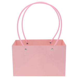 Różowa torebka kwiatowa o wymiarach 32x22x11 cm z wygodnymi uchwytami, przeznaczona do estetycznego pakowania kwiatów ciętych oraz roślin doniczkowych.
