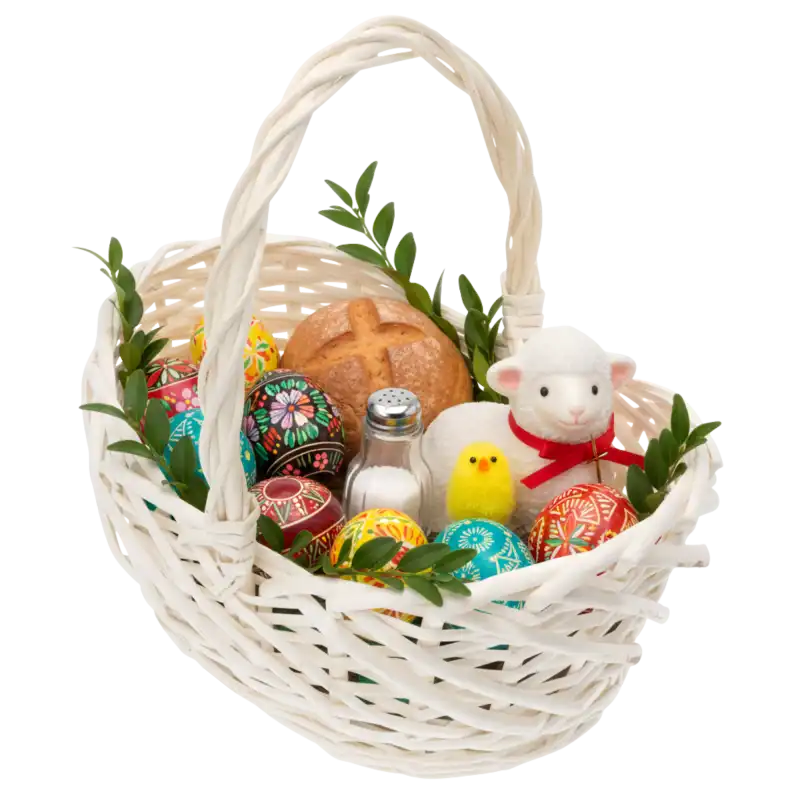 Owalny kosz wiklinowy wypełniony wielkanocnymi ozdobami, takimi jak pisanki, baranek oraz pieczywo, gotowy na święconkę.