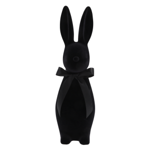 Czarny welurowy zając o wysokości 47 cm z elegancką satynową kokardą na szyi. Nowoczesna dekoracja wielkanocna o flokowanej, miękkiej powierzchni, która stanowi wyrazisty akcent w każdym wnętrzu.