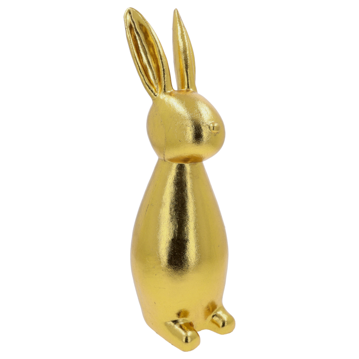 Figurka zająca z tworzywa w złotym, postarzanym kolorze. Nowoczesna forma o wysokości 47 cm ustawiona w profilu.