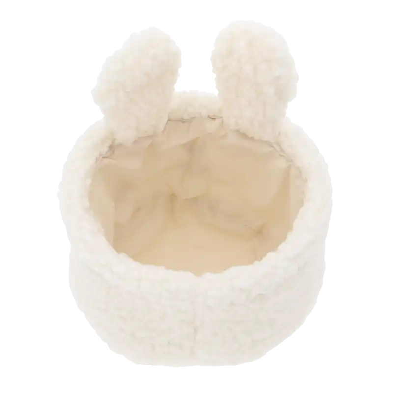 Wnętrze białego kosza królika o średnicy 17 cm. Pojemnik posiada jasną wyściółkę, co sprawia, że jest estetyczny i praktyczny do przechowywania różnych drobnych akcesoriów w domu.