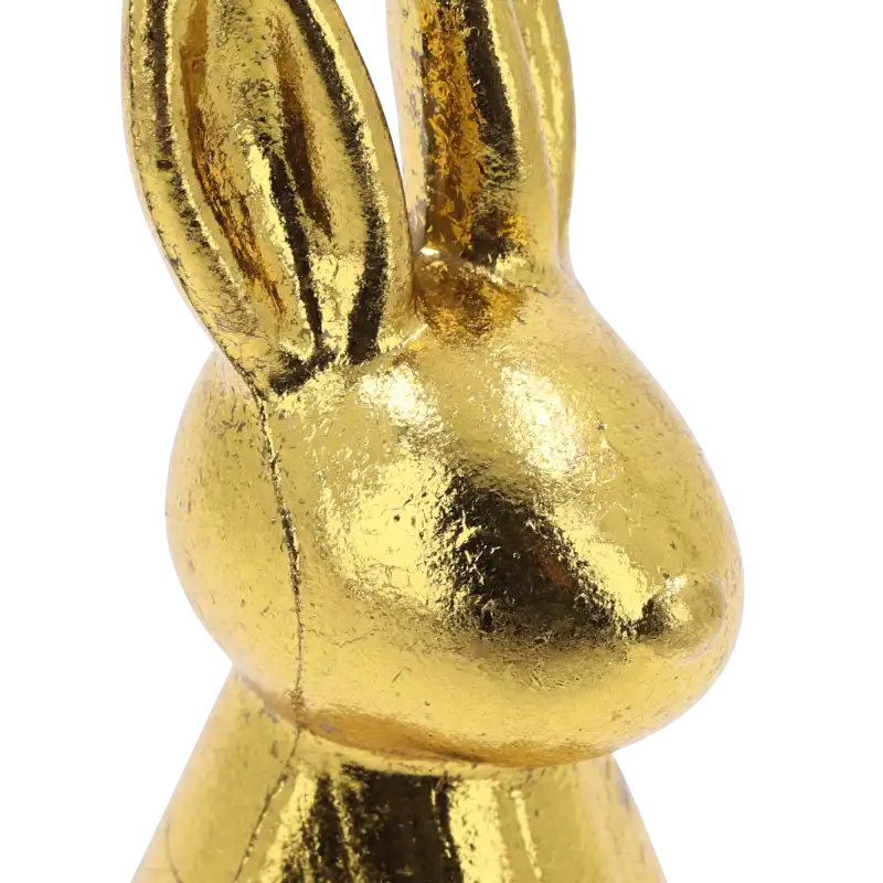 Detale wykończenia złotego zająca o wysokości 15 cm. Nowoczesna sylwetka w postarzanym kolorze tworzy efektowny akcent w sypialni.