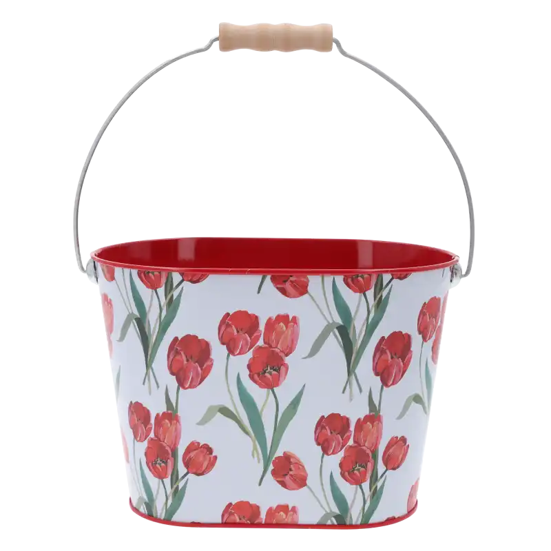 Metalowa osłonka wiaderko z motywem tulipanów o wymiarach 13x20 cm. Posiada drewnianą rączkę i wiosenny design.