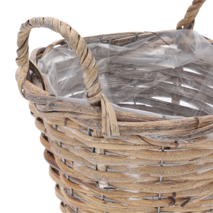 Zbliżenie na splot naturalnej wikliny oraz dekoracyjne uszy ułatwiające przenoszenie tej doniczki o średnicy 20 cm.