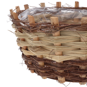 Zbliżenie na splot naturalnego drewna w okrągłej osłonce z widoczną folią ochronną.