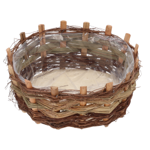 Zbliżenie na wnętrze owalnej osłonki z kory, w której widoczna jest przezroczysta folia ochronna.
