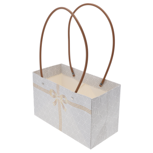 Widok na wnętrze papierowej torebki kwiatowej o wymiarach 32x22x10 cm z widocznymi brązowymi rączkami pod kątem.