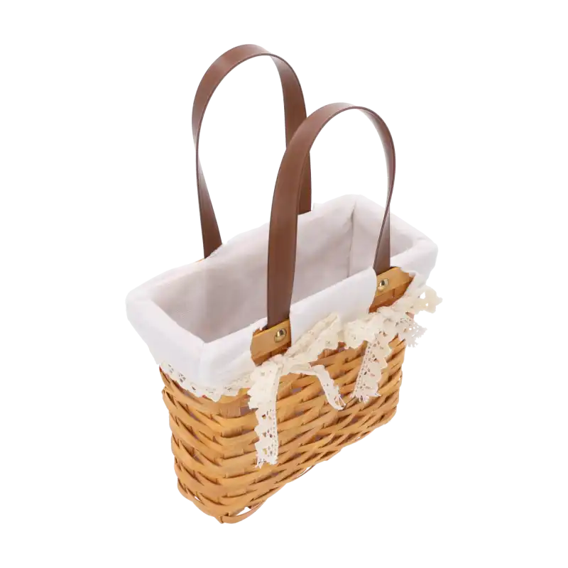 Wnętrze kosza z łuby z wyjmowanym materiałem, ukazujące strukturę plecionki oraz brązowe, wygodne rączki do przenoszenia produktu.