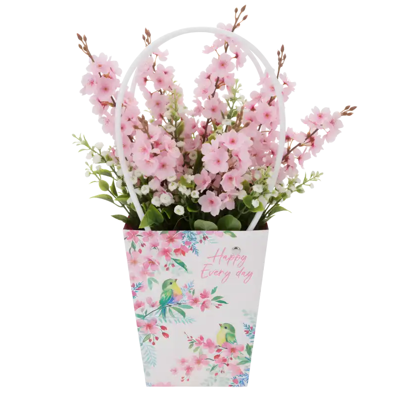 Torebka kwiatowa Happy Every Day z umieszczoną wewnątrz kompozycją różowych sztucznych kwiatów, prezentująca sposób wykorzystania opakowania.