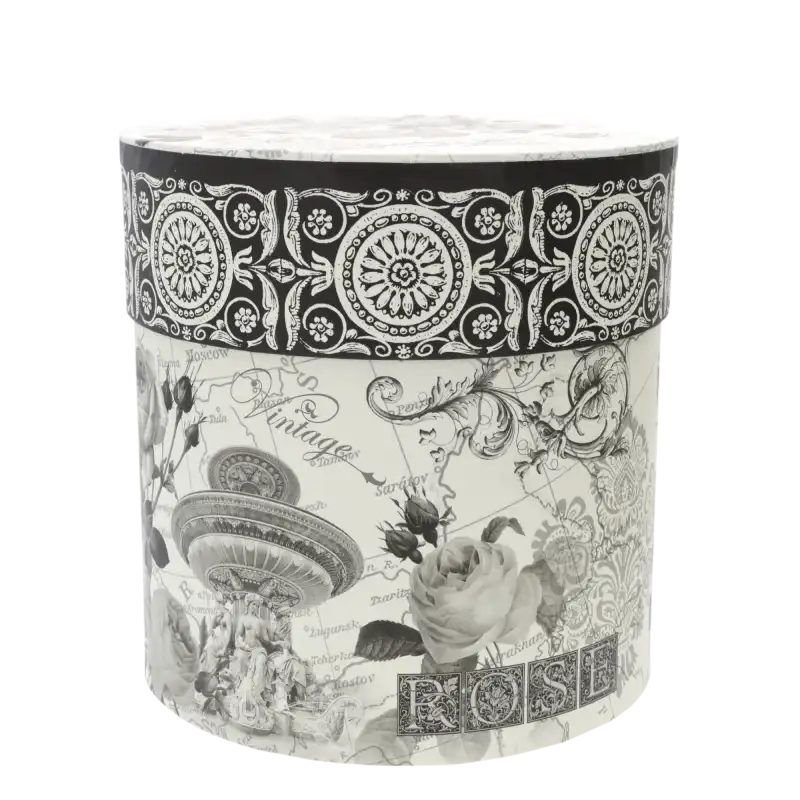 Zbliżenie na okrągły flower box vintage z motywem kwiatowym i dekoracyjnym nadrukiem na całej powierzchni pudełka.