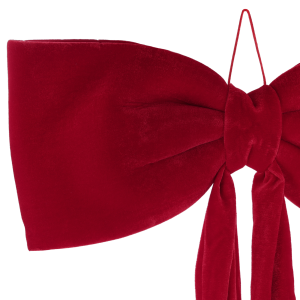 Zbliżenie na węzeł i eleganckie wykończenie czerwonej kokardy wykonanej z wysokiej jakości miękkiego w dotyku weluru.