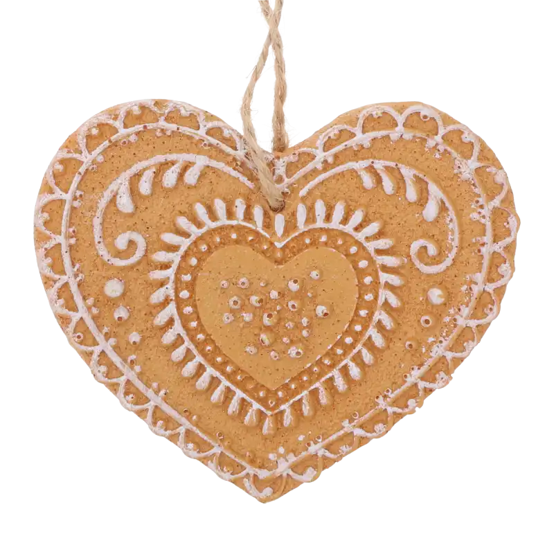 Świąteczna zawieszka serce z piernika o wymiarach 9x8 cm. Dekoracja posiada naturalny kolor i precyzyjne wzory imitujące biały lukier na powierzchni.